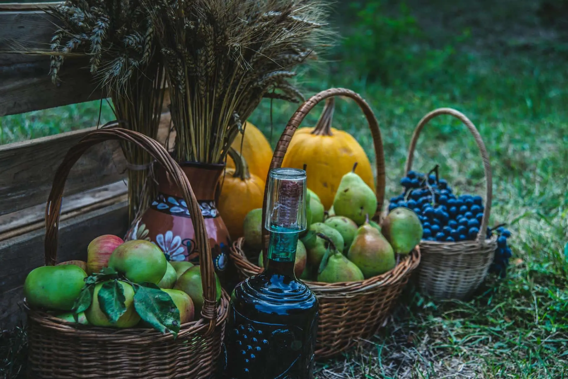 autumn harvest display with apples and pumpkins